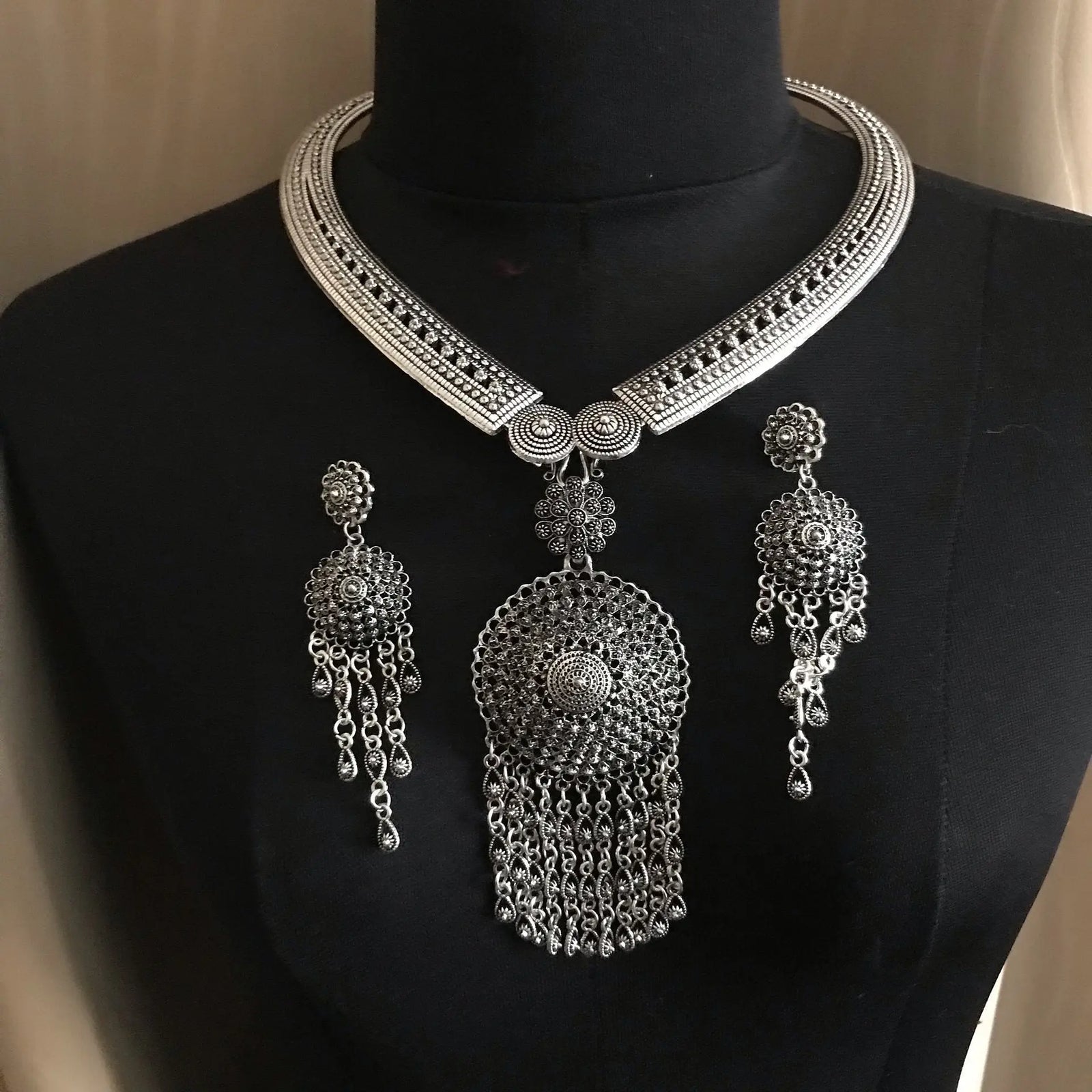 The shiny German Silver jewelry and decorative items showcase intricate craftsmanship and bright silver-like metallic finish.