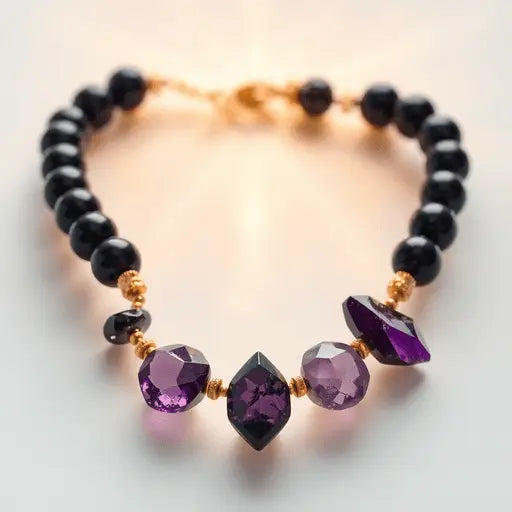 Close-up of a stylish bracelet with black tourmaline and amethyst crystals against a soft, glowing background symbolizing positive energy and balance.