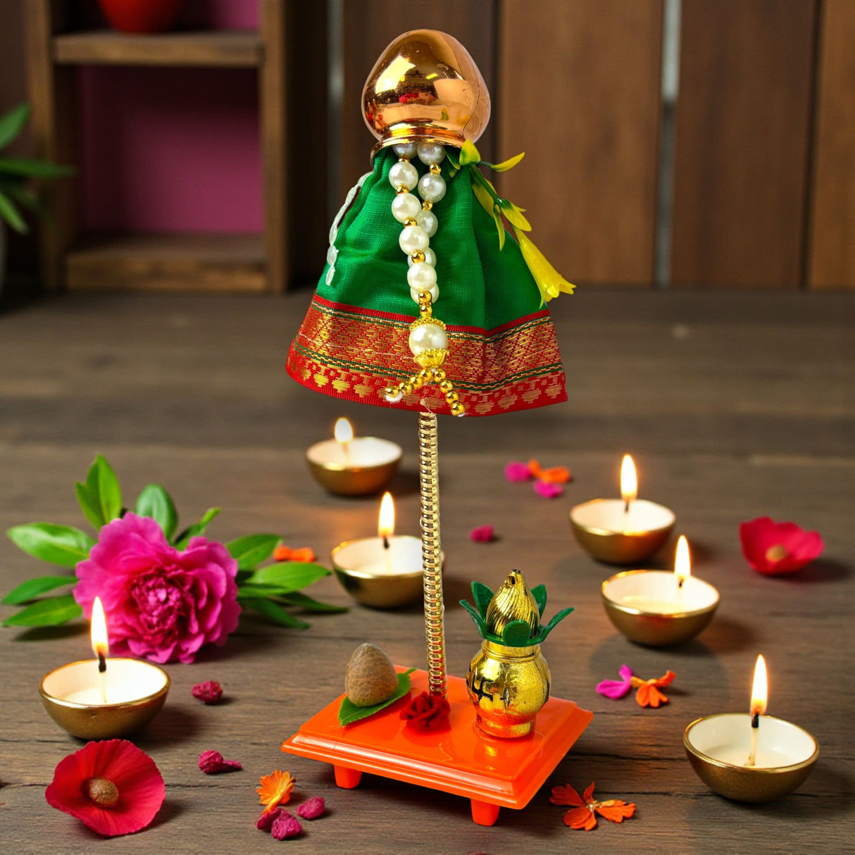 Golden metallic Gudi Padwa idol in green red dress with pearls, 9-inch showpiece