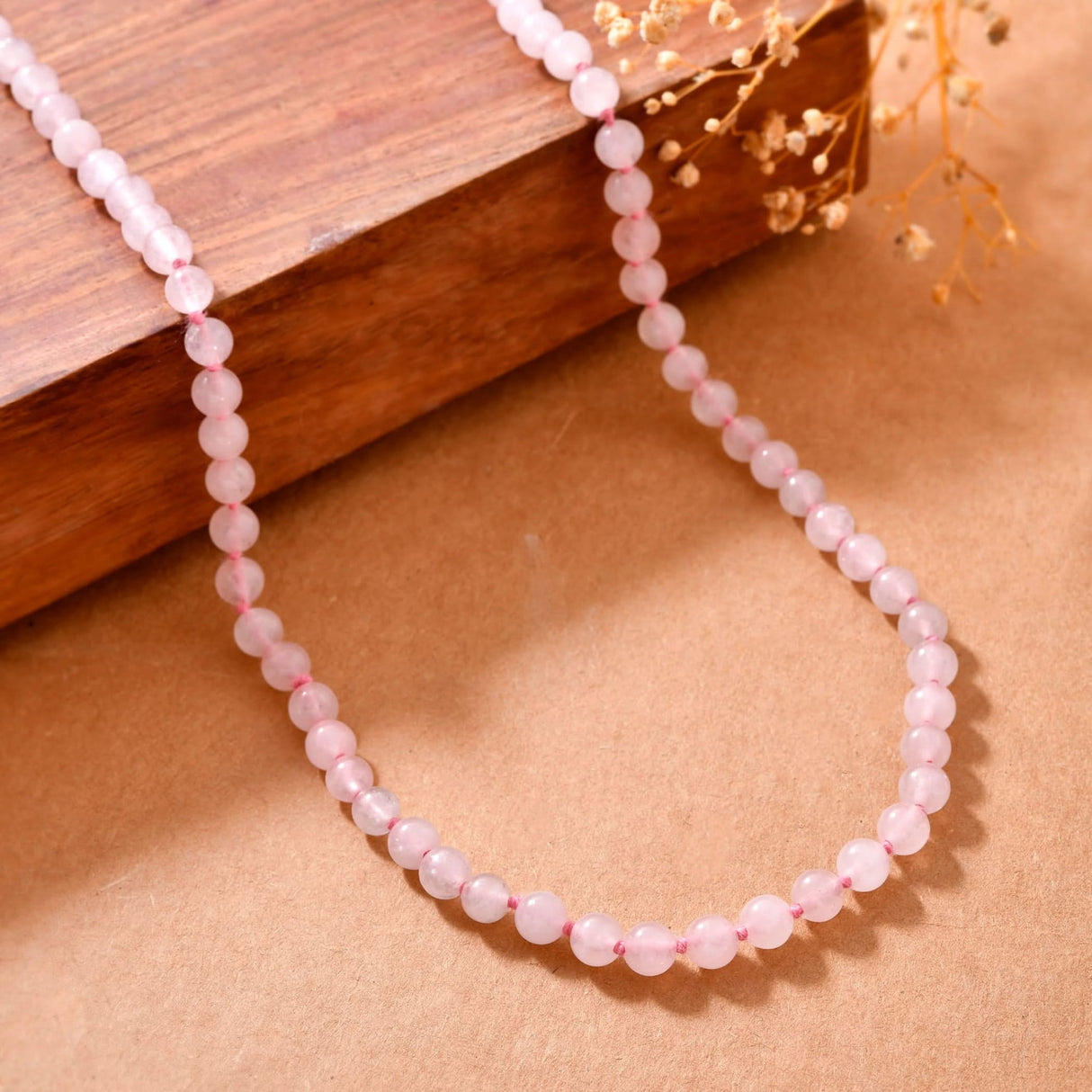 Pink beaded necklace from LOVENSPIRE 108 Mala Beads Natural Healing Crystal Jewelry