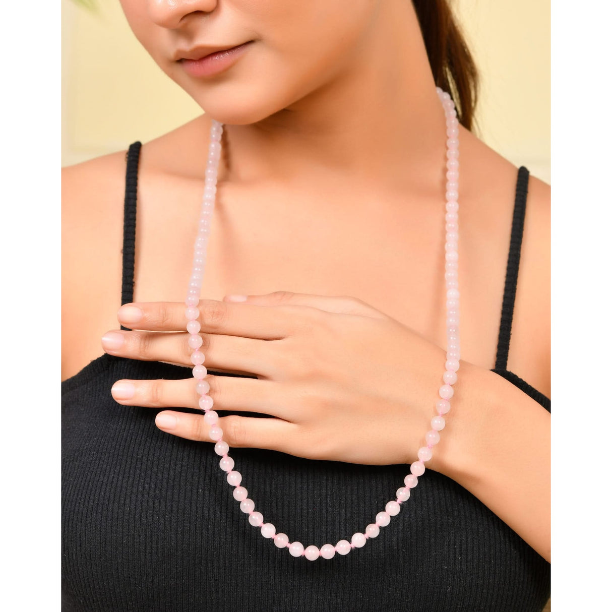 Pink beaded necklace featuring natural healing crystal gemstones, ideal for yoga and meditation