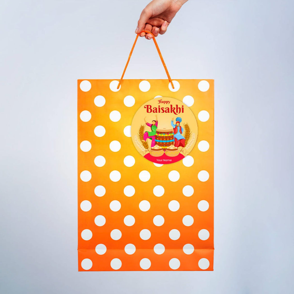 Orange polka-dot gift bag with Baisakhi sticker for Punjabi festival celebrations