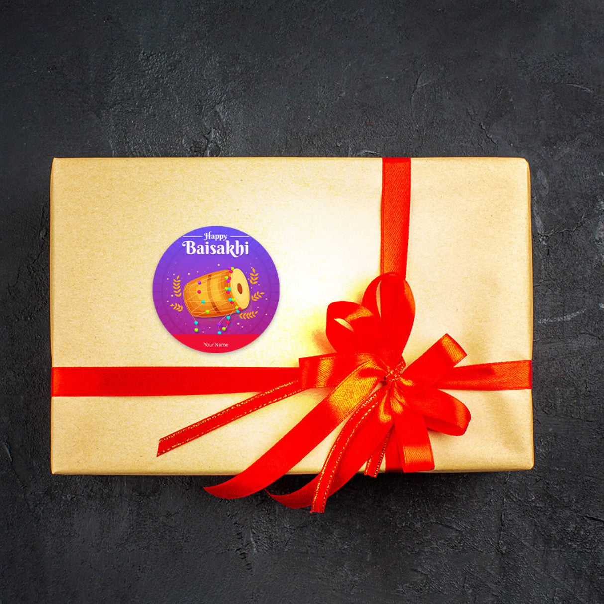 Gold gift box with red ribbon, ideal for Baisakhi and Punjabi festival celebrations