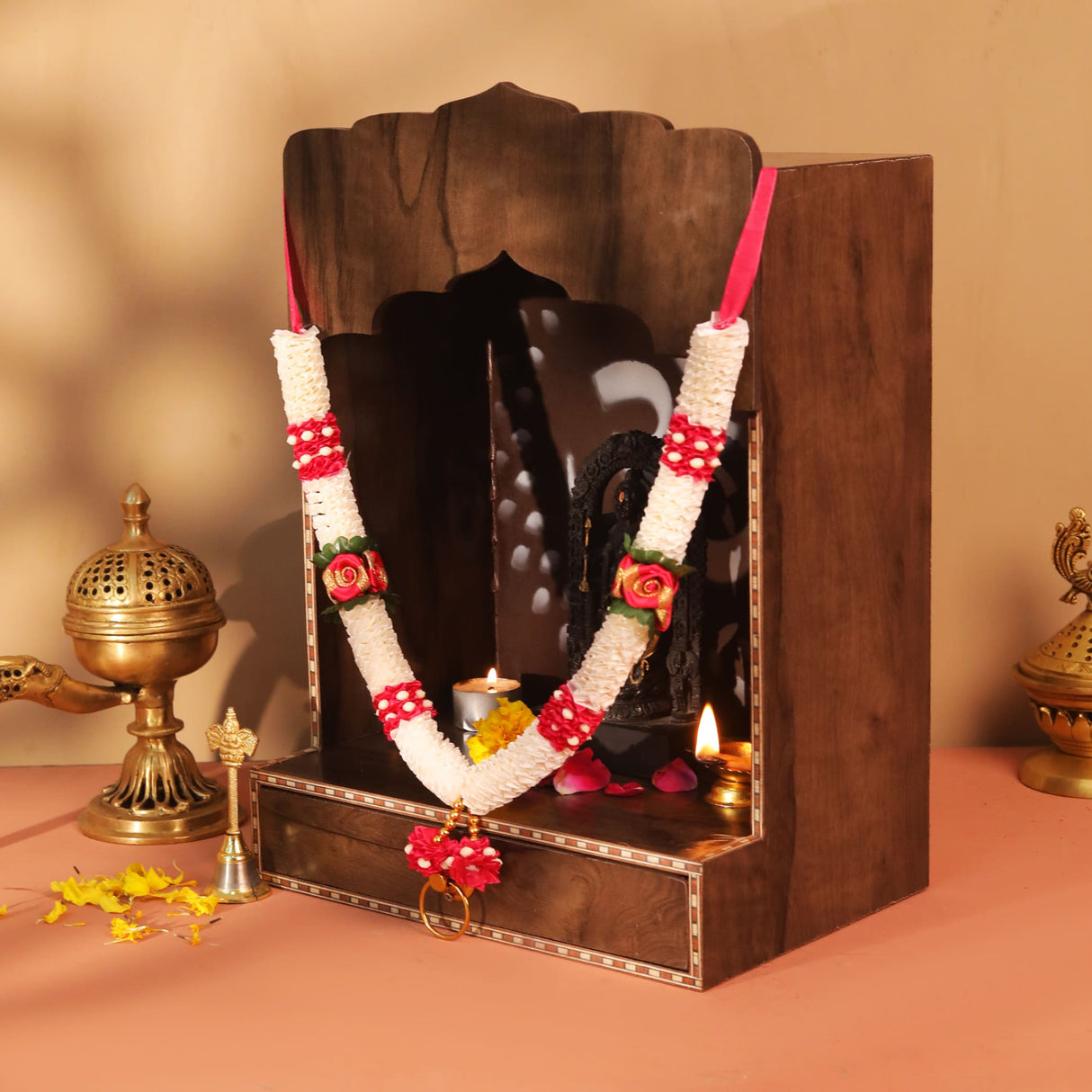 Dark brown wooden altar with white red satin idol mala garland