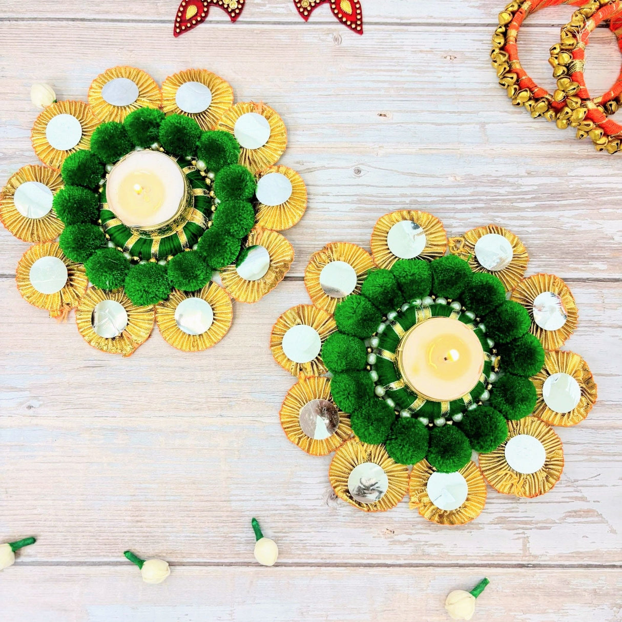 Decorative candle holders with gold and green accents for Diwali and festive celebrations