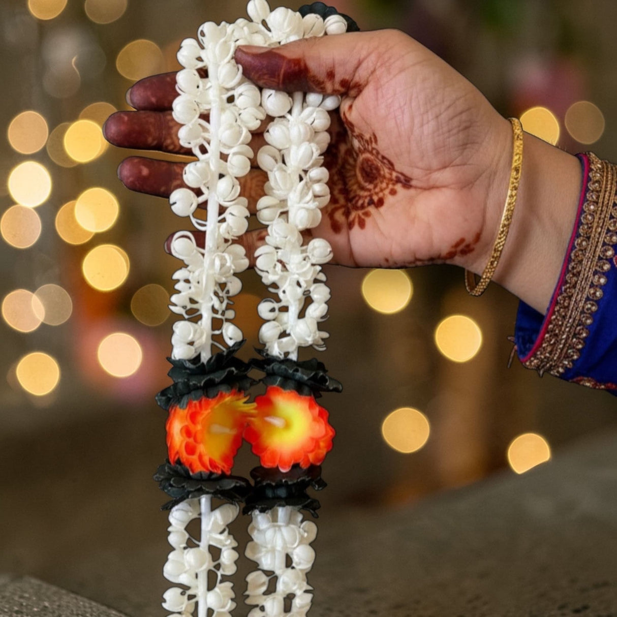 2 strings artificial jasmine buds garland with delicate white plastic flowers black accents and orange yellow centers for festivals
