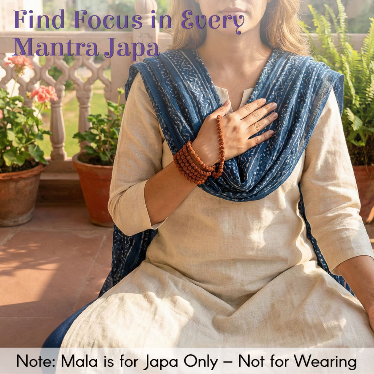 Brown wooden Rudraksha 5-face mala on wrist with Gomukhi japa bag