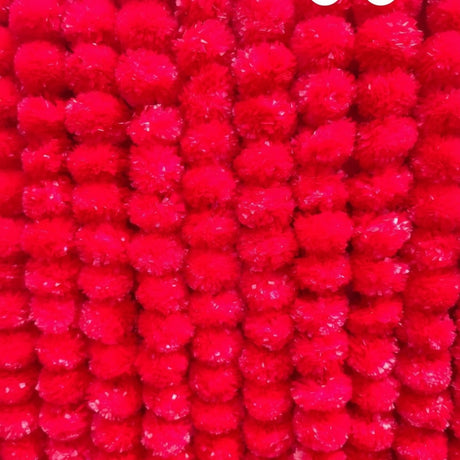 Vibrant red pom-pom garlands for Diwali Navratri and festive celebration decor