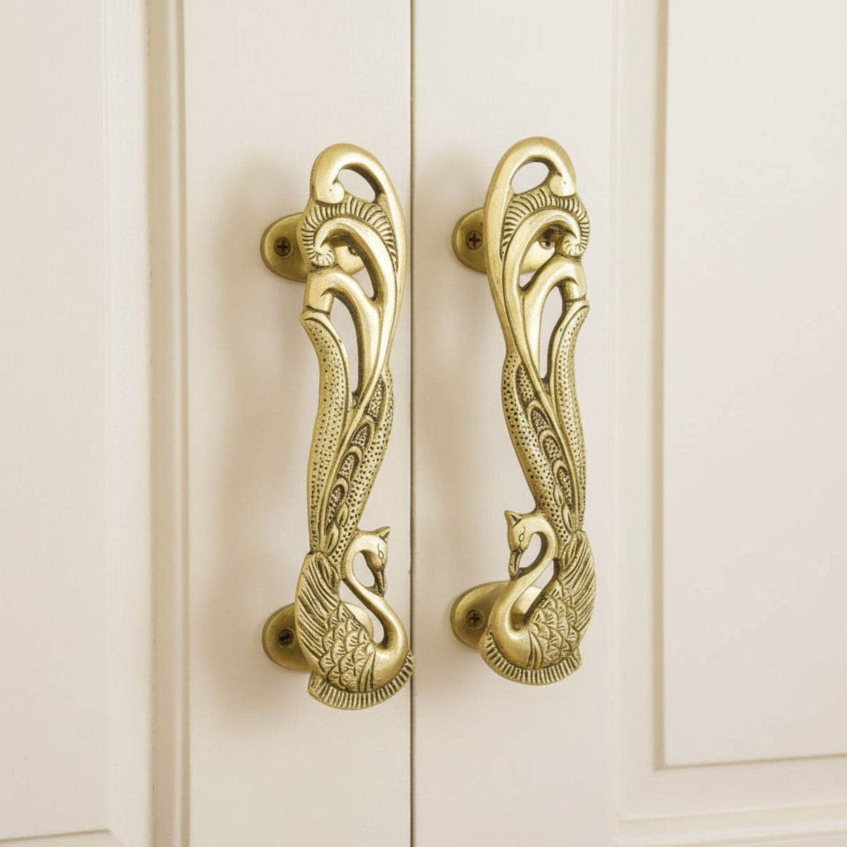 Pair of 7-inch ornate brass peacock cabinet handles with feather details