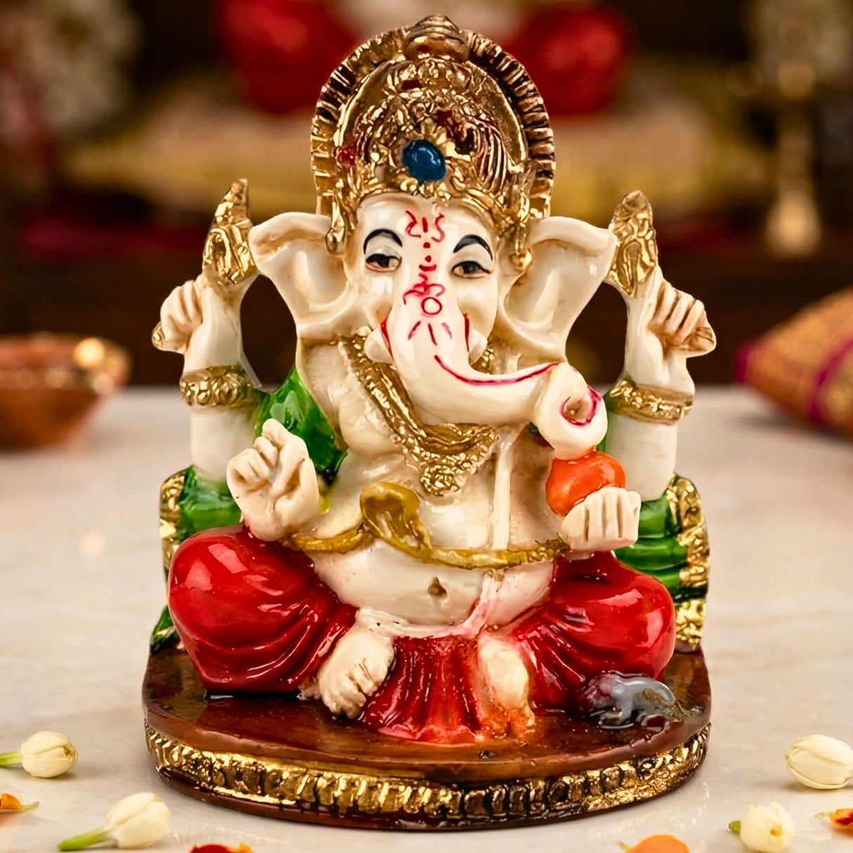 Acrylic ganesh statue 2.25 inch with ornate white body, vibrant red and green garments, and gold accents for home pooja