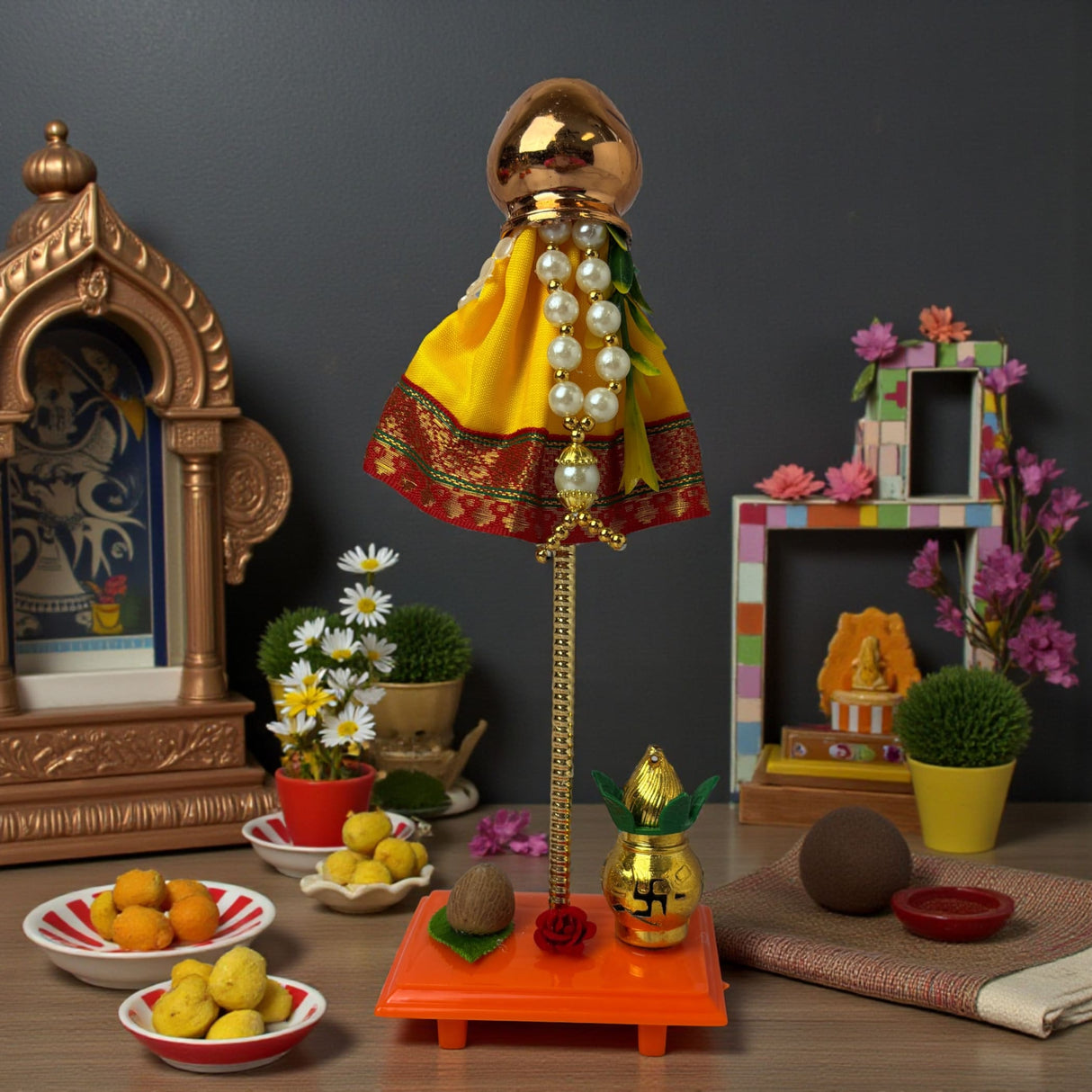 Golden ceremonial mini dholak with yellow red fabric, pearl beads for Gudi Padwa