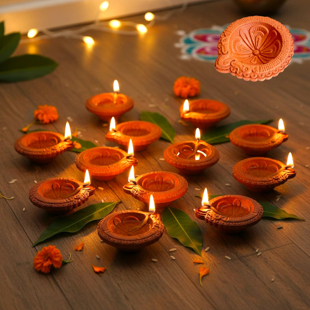 Traditional handmade terracotta diya with floral carvings, warm orange hue