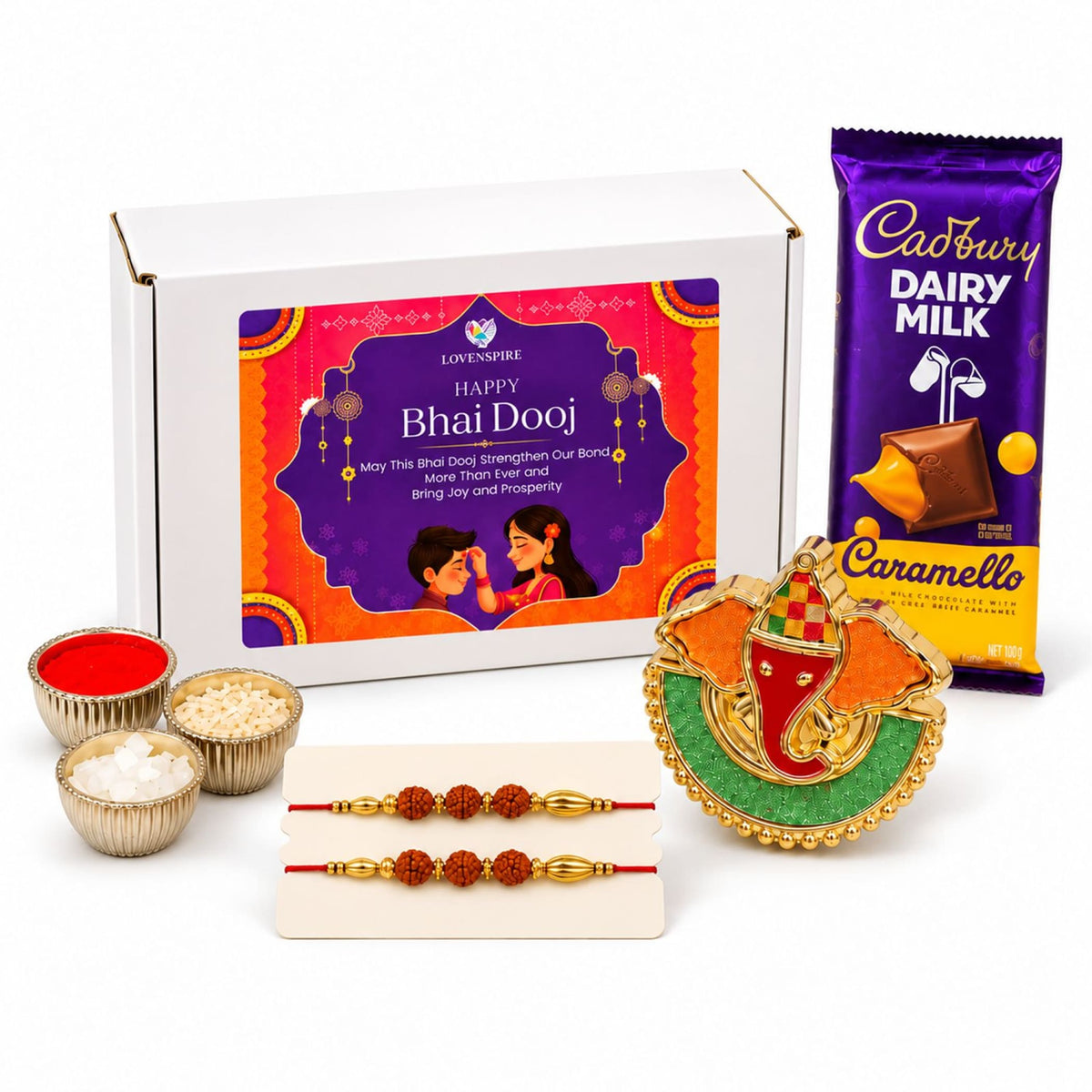 Gold-colored elephant-shaped ganesha ornament with red and green enamel accents in bhai dooj gift hamper set