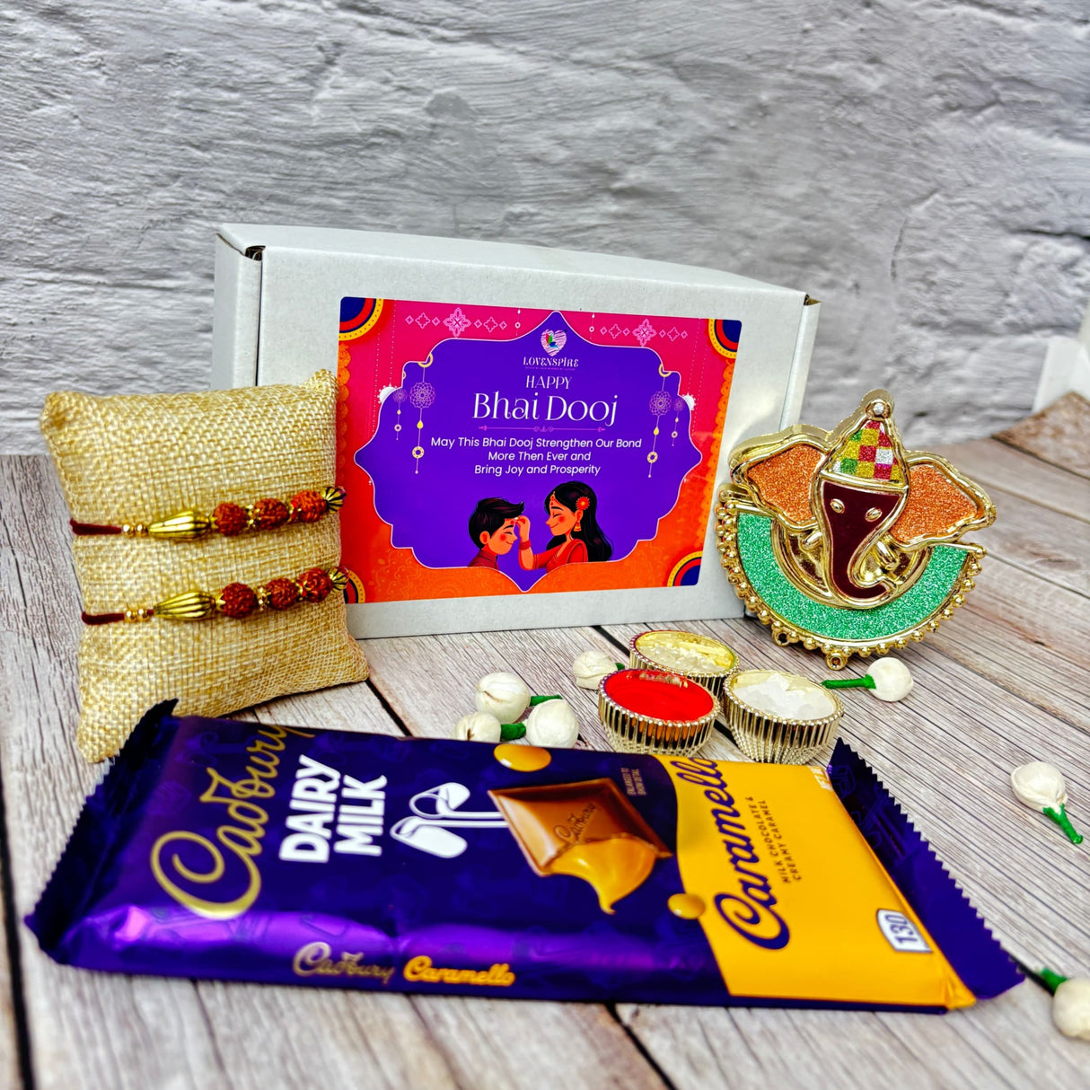 Bhai Dooj gift set with chocolate, traditional bracelets, and Ganesha idol in premium box