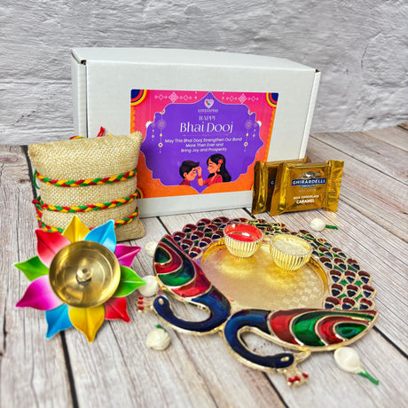 Bhai Dooj gift hamper with chocolates, decorative diya, cushion, and peacock-shaped thali