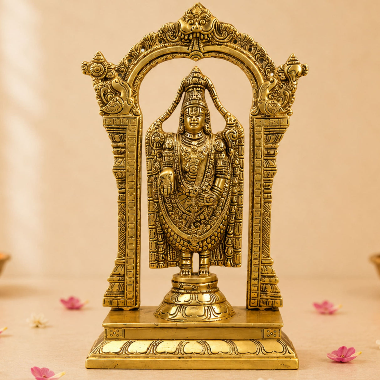 Golden brass statue of lord Venkateswara standing within an ornate archway frame for pooja and home decor