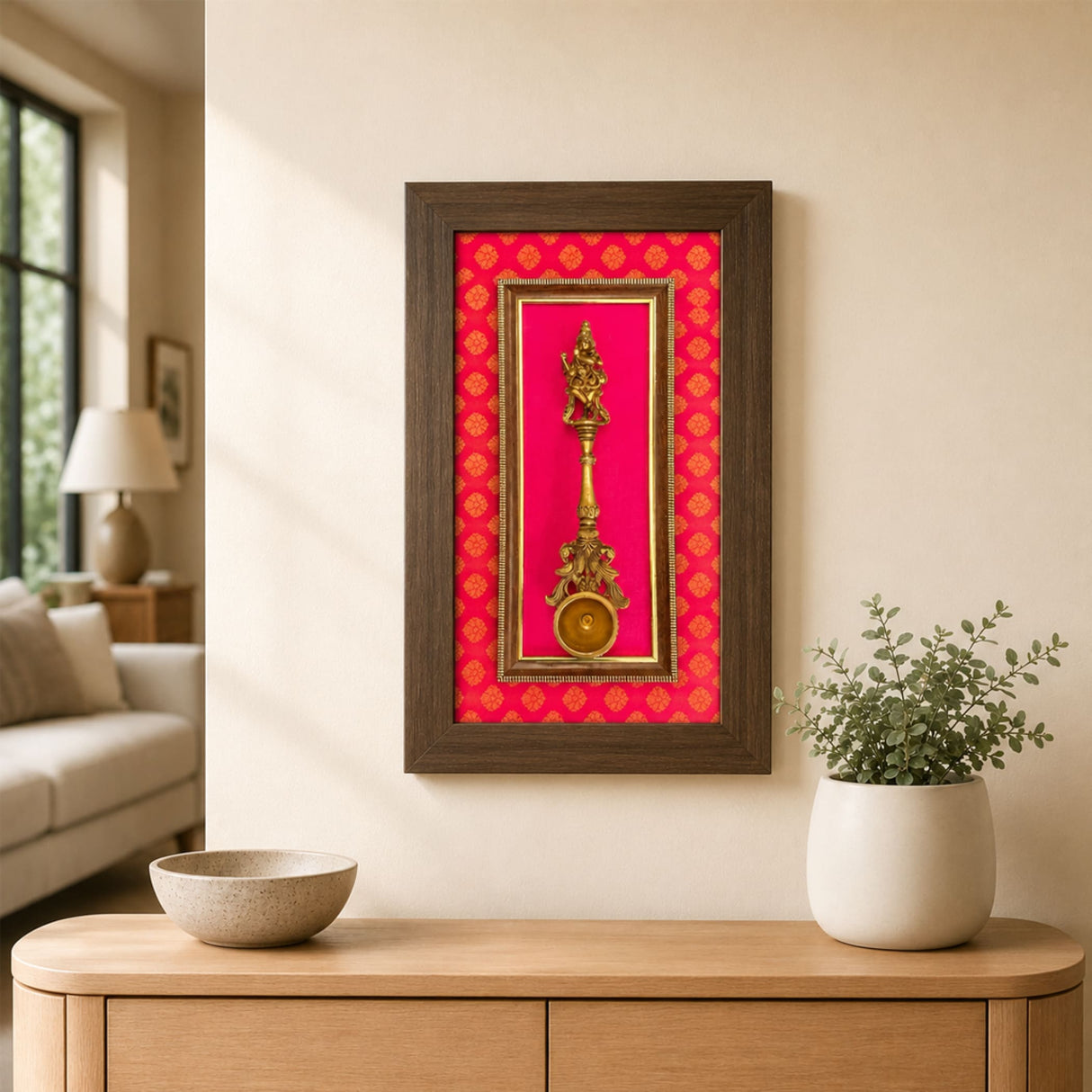 Golden brass decorative dancing krishna deity figurine mounted in a framed display with vibrant red patterned backing