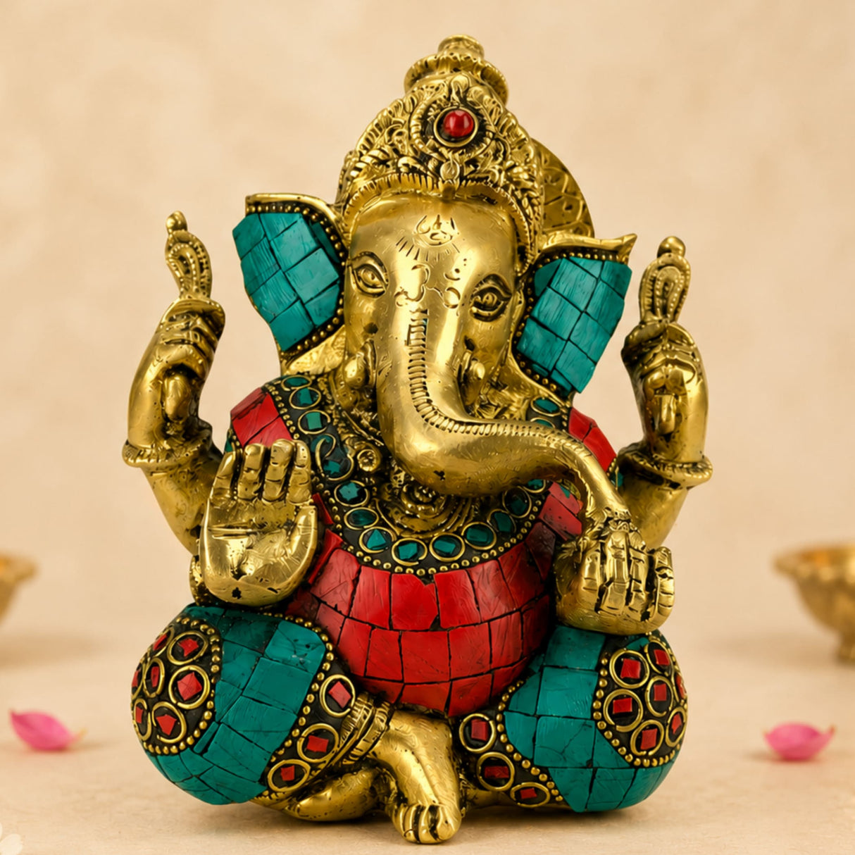 Brass ganesha statue idol with golden finish turquoise mosaic inlays and red gemstones for pooja and home decor