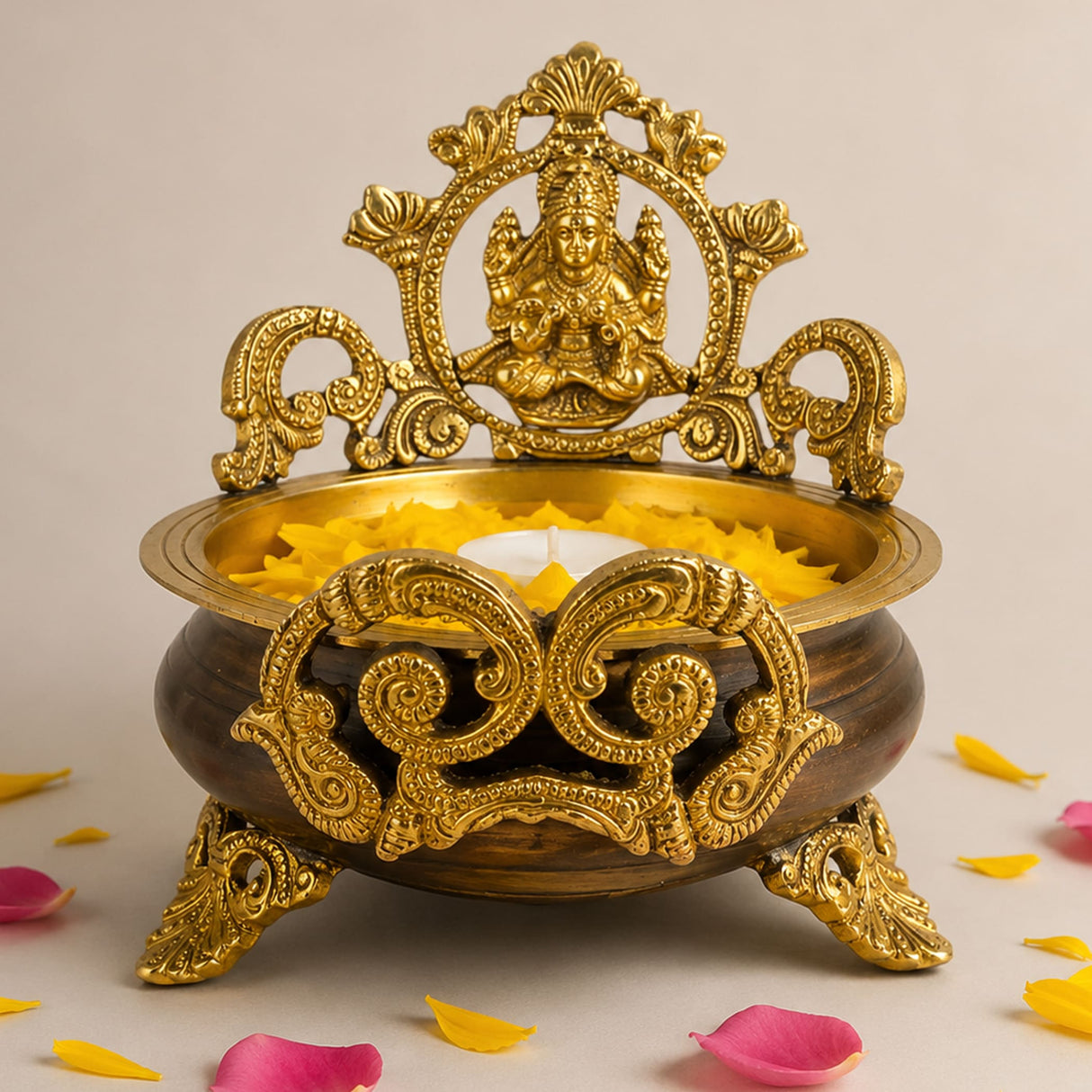 Golden ornate brass laxmi urli bowl 6.6 inch with intricate filigree and seated deity for home temple decor and pooja