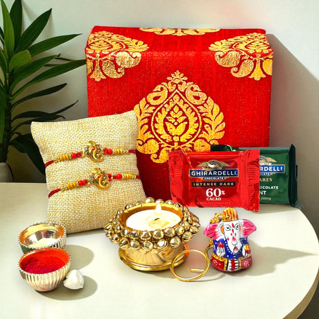 Elegant Brocade Rakhi Gift Set with Chocolates, Candle Holder, and Rakshabandhan Card