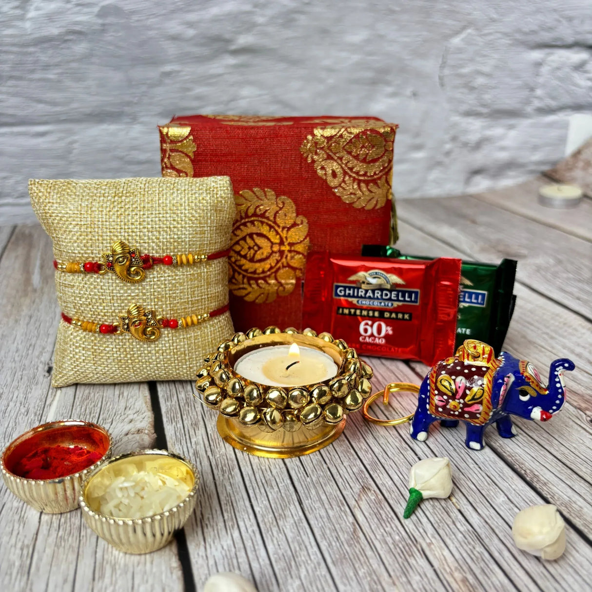 Rakhi Gift Hamper for Brother 2PC Ganesha Rakhi with Candle Holder Ceramic Key Chain Roli Chawal Rakshabandhan Card Chocolates with Premium Brocade Gift Box - Bracelet for Bhai Bhabhi - LoveNspire