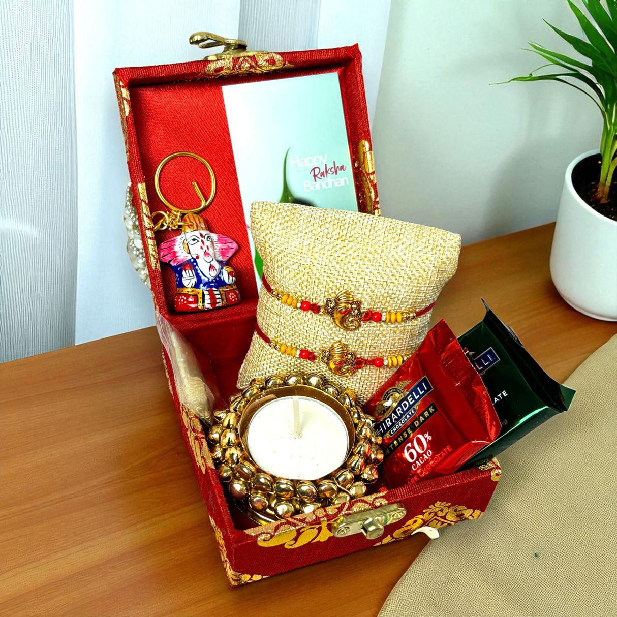 Rakhi Gift Hamper for Brother 2PC Ganesha Rakhi with Candle Holder Ceramic Key Chain Roli Chawal Rakshabandhan Card Chocolates with Premium Brocade Gift Box - Bracelet for Bhai Bhabhi - LoveNspire