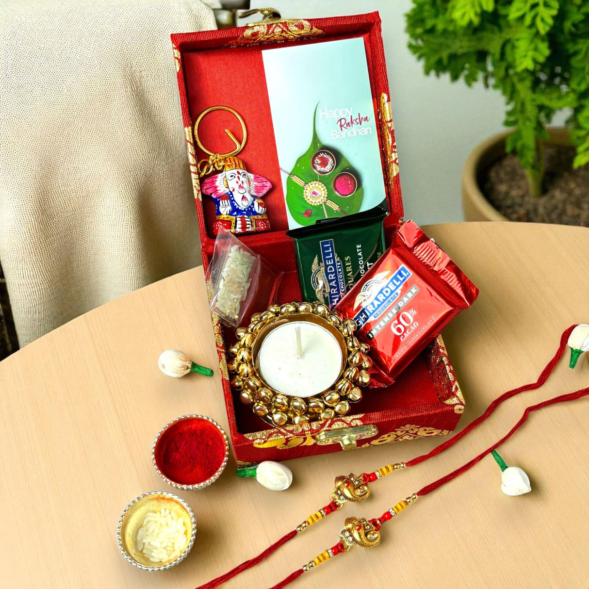 Rakhi Gift Hamper for Brother 2PC Ganesha Rakhi with Candle Holder Ceramic Key Chain Roli Chawal Rakshabandhan Card Chocolates with Premium Brocade Gift Box - Bracelet for Bhai Bhabhi - LoveNspire