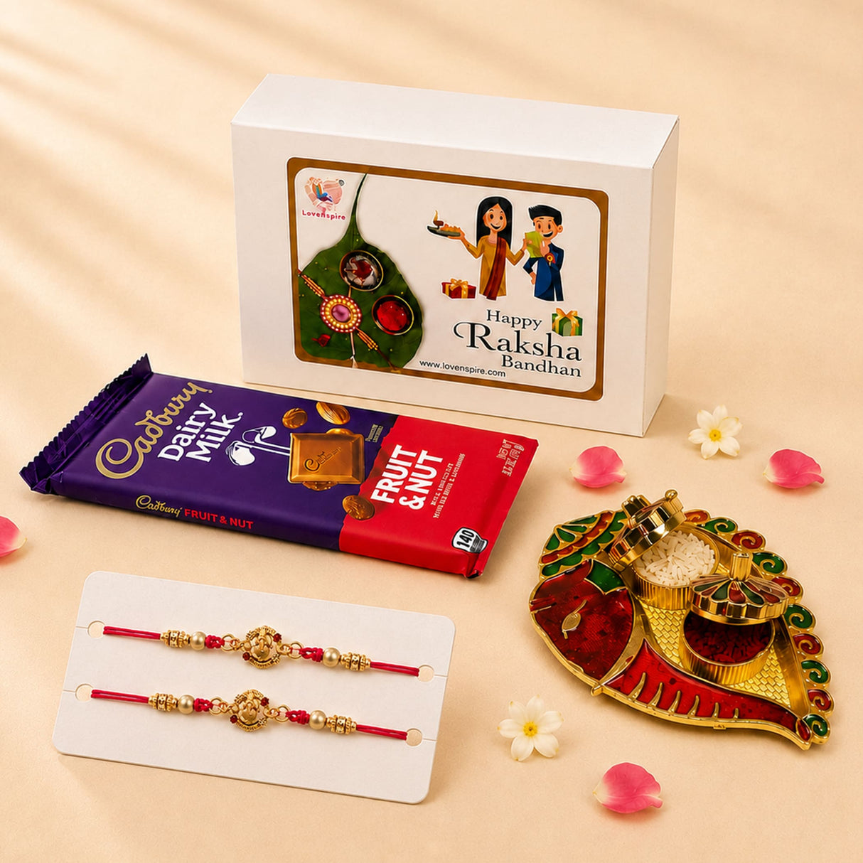 Designer gold and red ornate rakhi with intricate designs and pearl-like beads in handmade raksha bandhan gift hamper