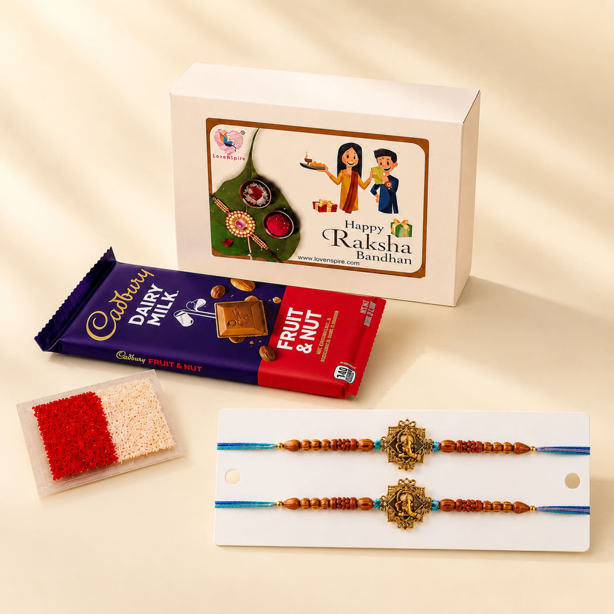 Gold-colored designer rakhi with intricate designs and wooden beads on blue thread for brother and bhabhi gift hamper