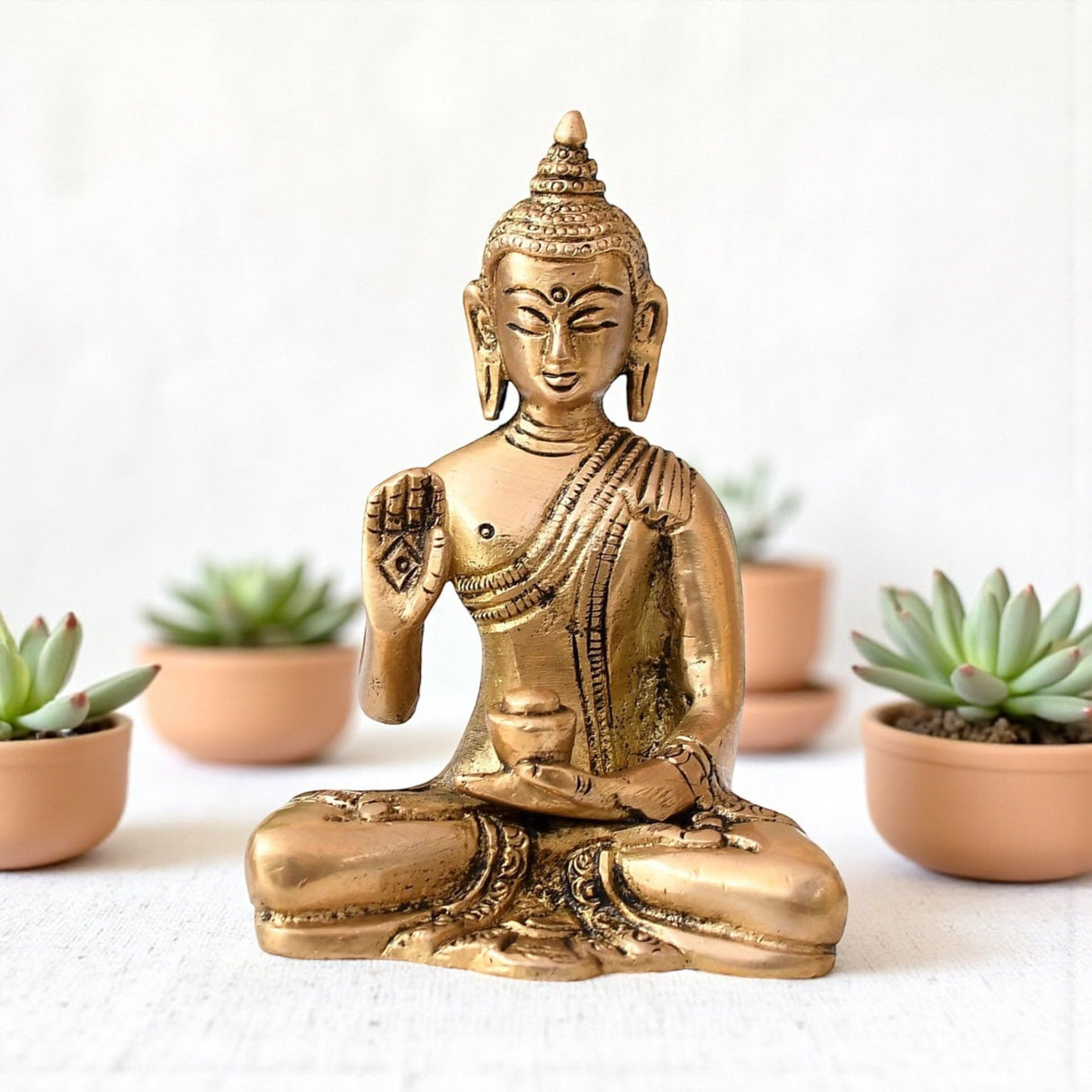 Shiny golden brass Buddha statue in meditative pose for home decor and spiritual meditation