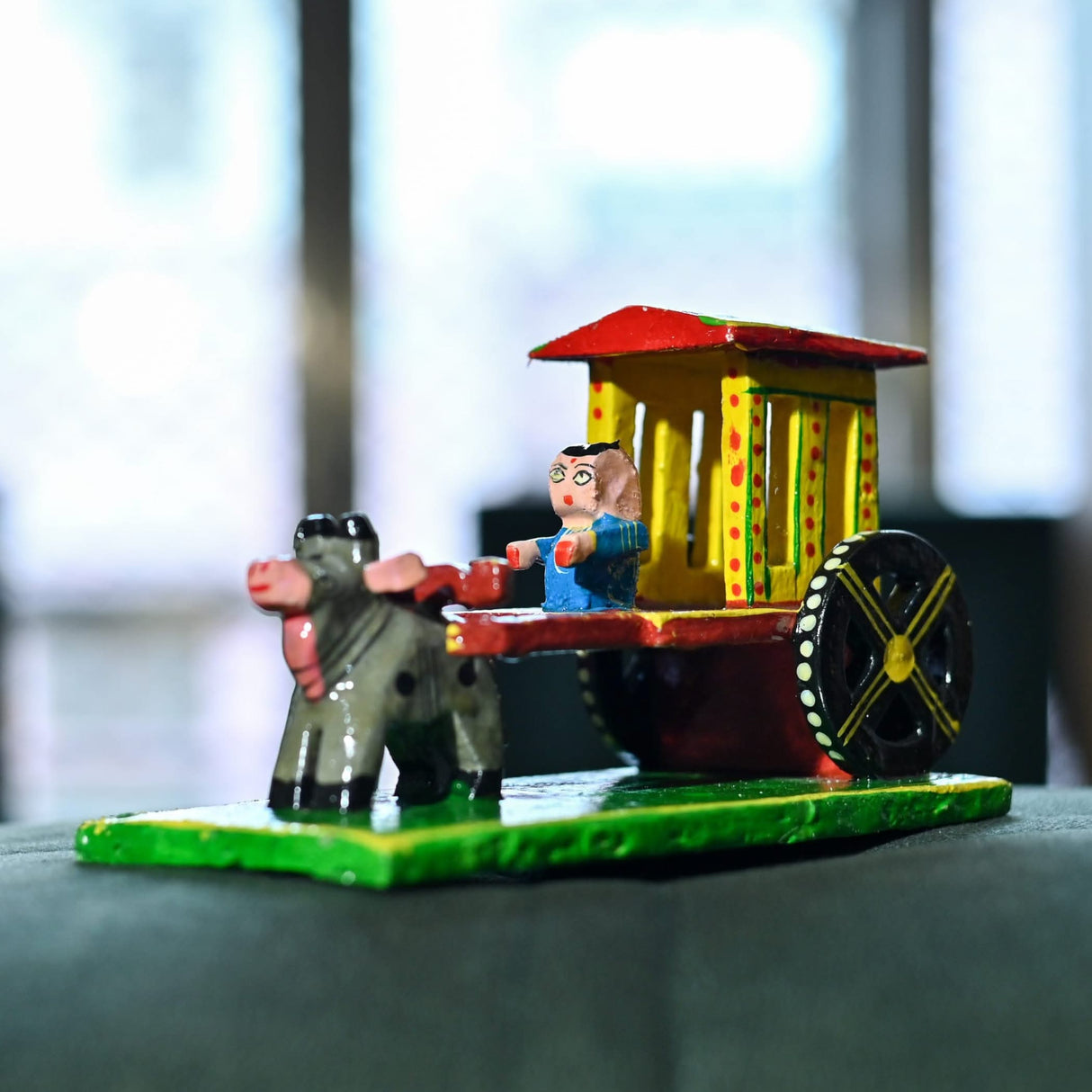 Colorful wooden bullock cart toy displayed as Indian Wooden Bullock Cart Decor Golu Showpiece