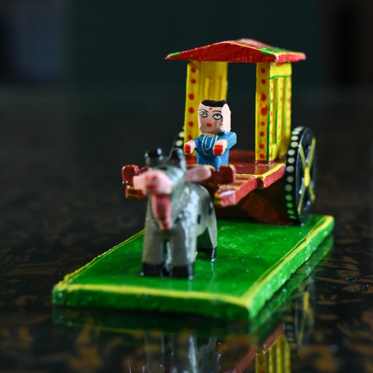 Handcrafted wooden bullock cart toy displayed as Indian Kondapalli Golu decoration for home