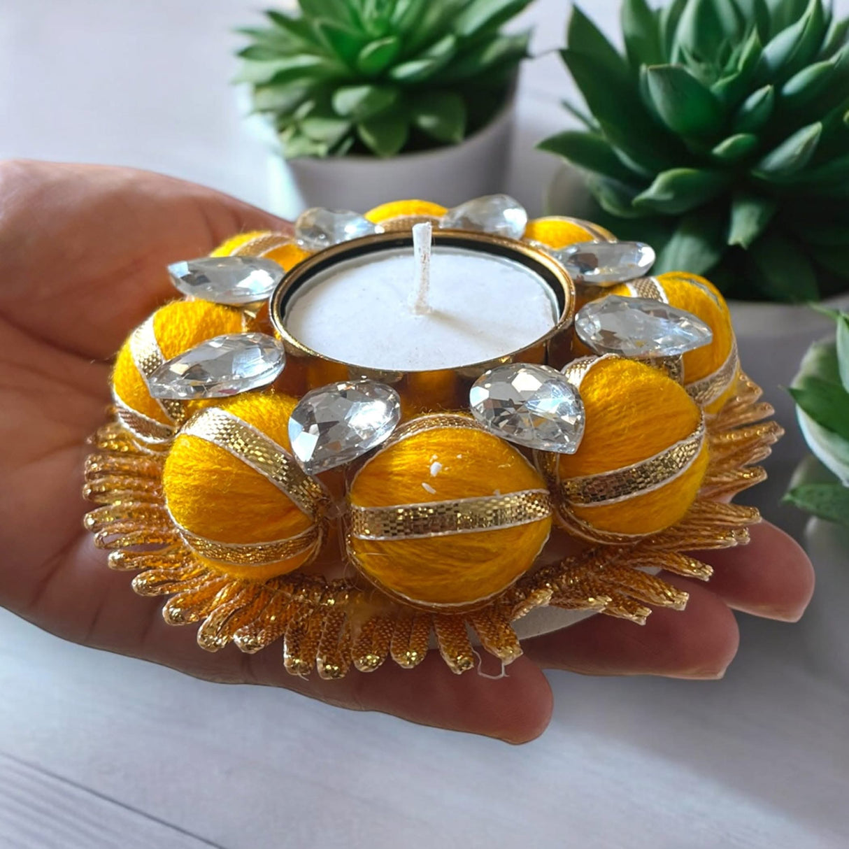 Handcrafted yellow and gold candle holder with faux gemstones for home decor and occasions
