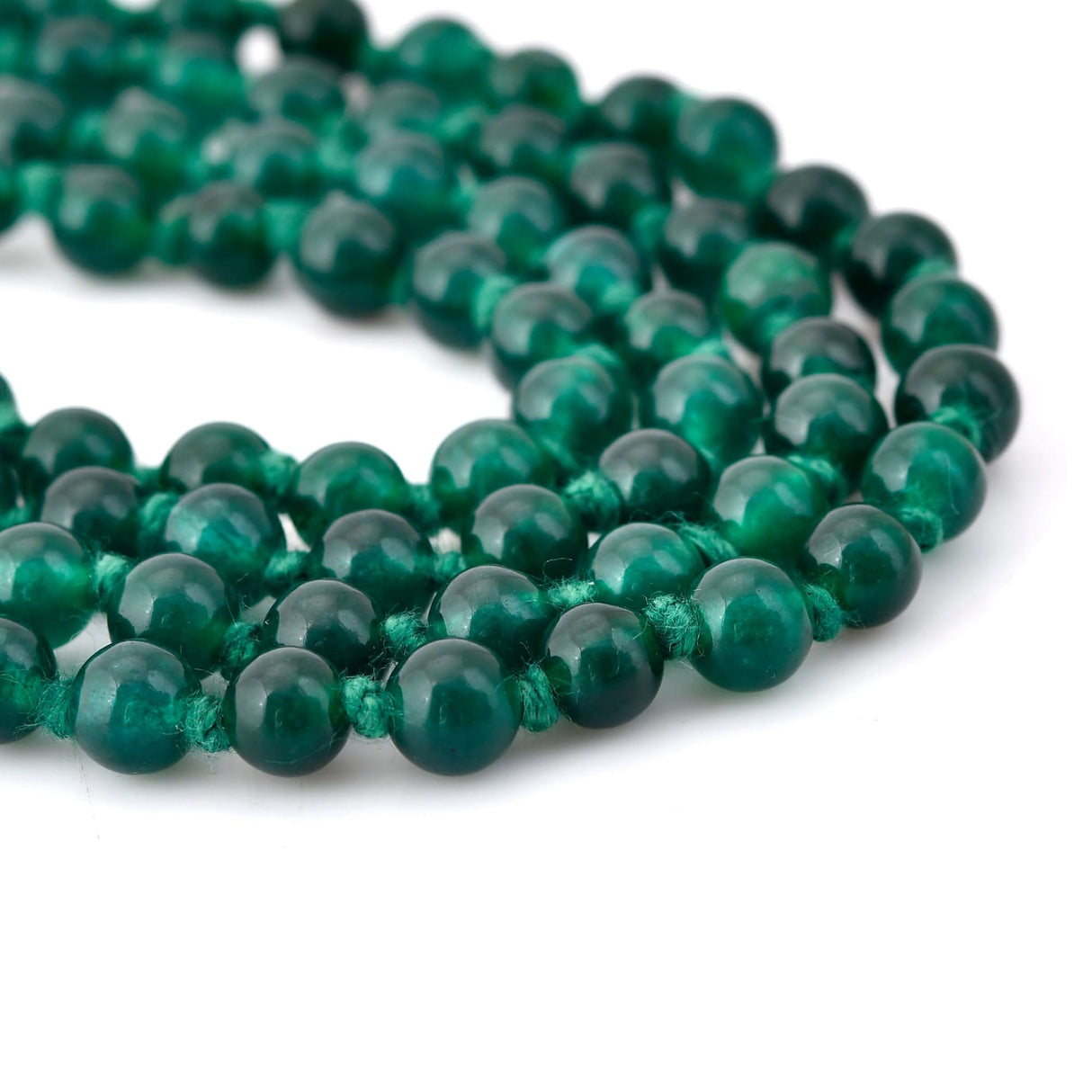 Green beaded necklace featuring 108 Mala beads with Chakra healing gemstones