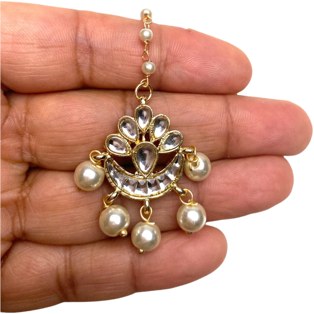 Gold-plated Chand Tikka jhumka with crescent design, clear stones, cream pearls