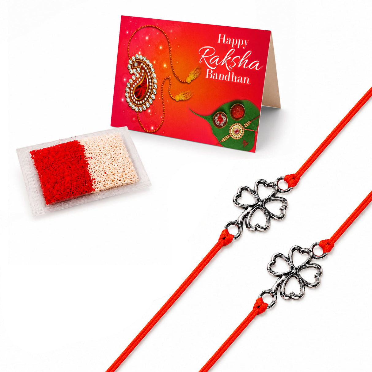 Two red cord rakhi bracelets with silver-toned four-leaf clover charms for traditional raksha bandhan gift