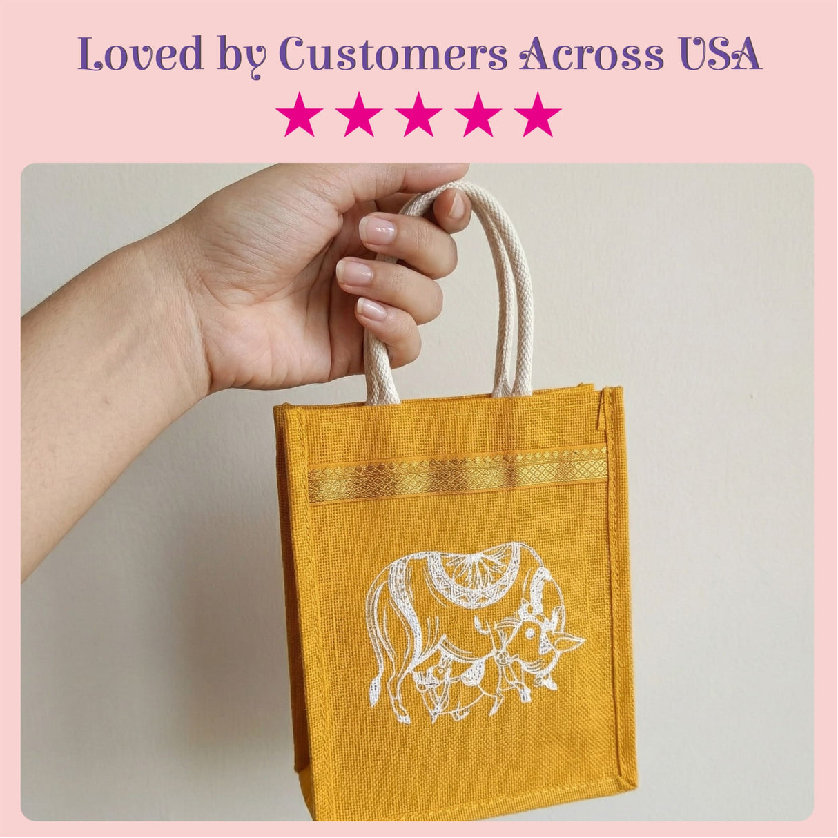 A mustard-yellow eco-friendly jute tote bag with white embroidered cow design and cream handles for Indian wedding favors