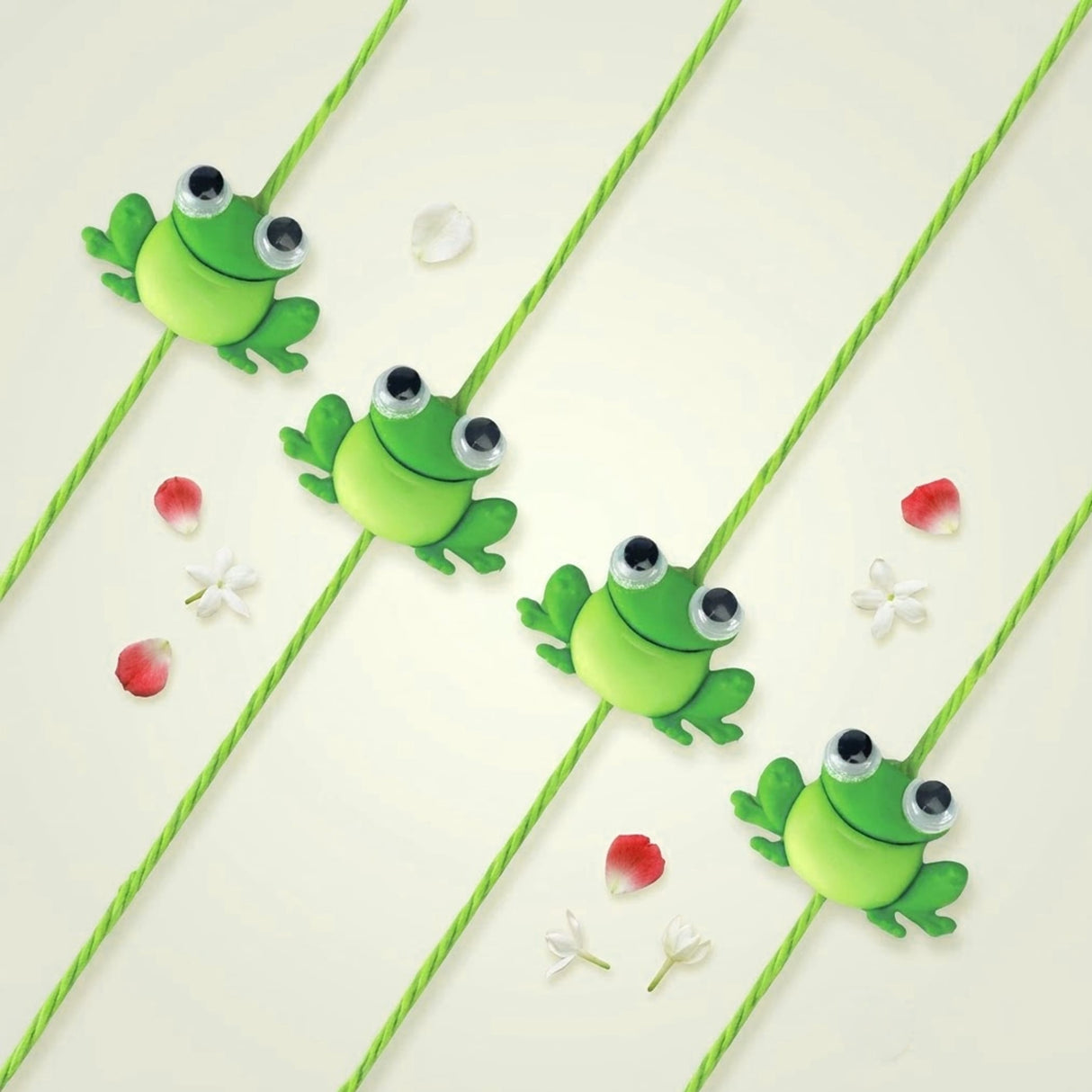 Bright green plush frog-shaped charm with black and white googly eyes from cartoon animal rakhi for kids set
