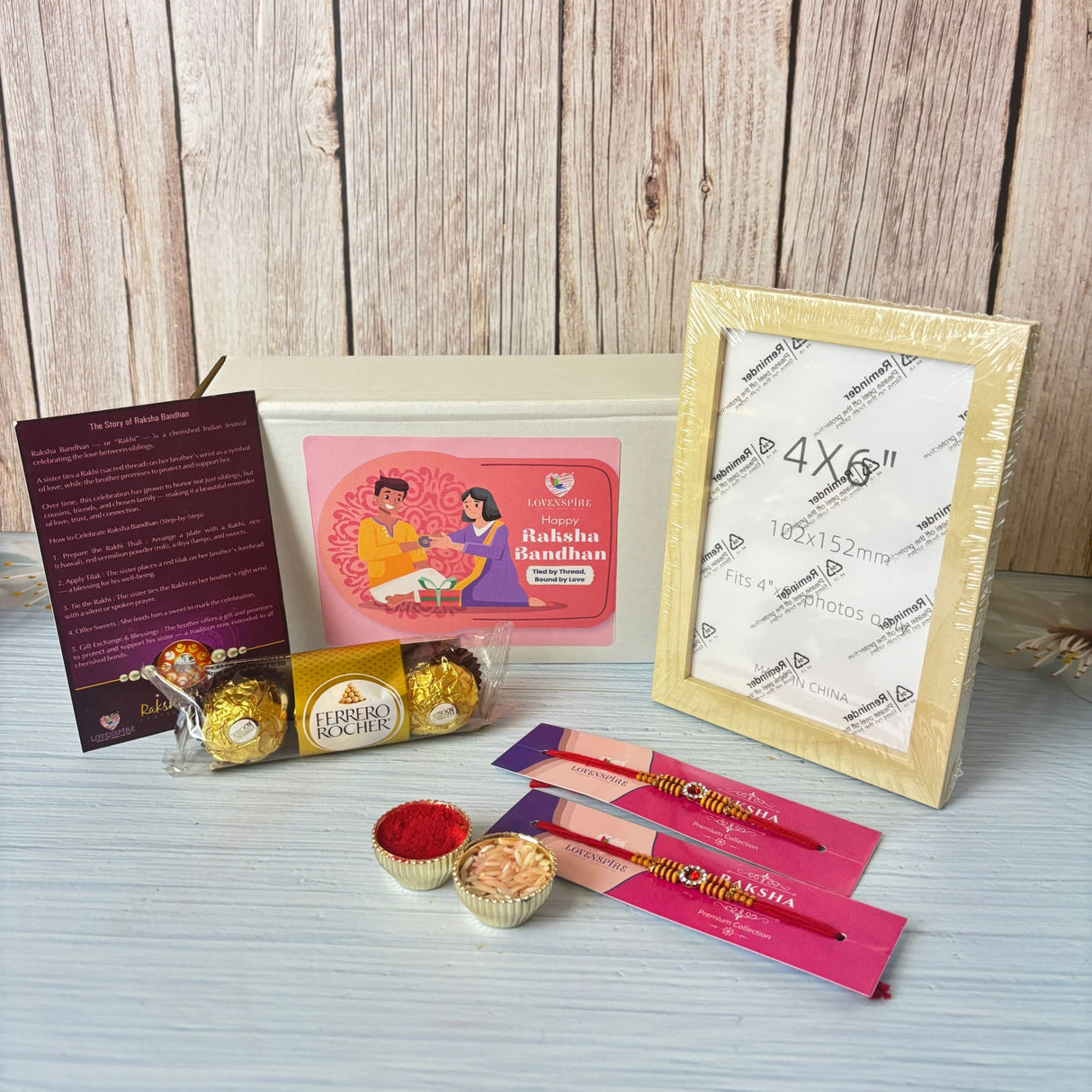 Designer Rakhi Gift Hamper for Brother & Bhabhi – Adjustable Rakhi Bracelet with Photo Frame, Chocolates, Roli Chawal & Card for Raksha Bandhan