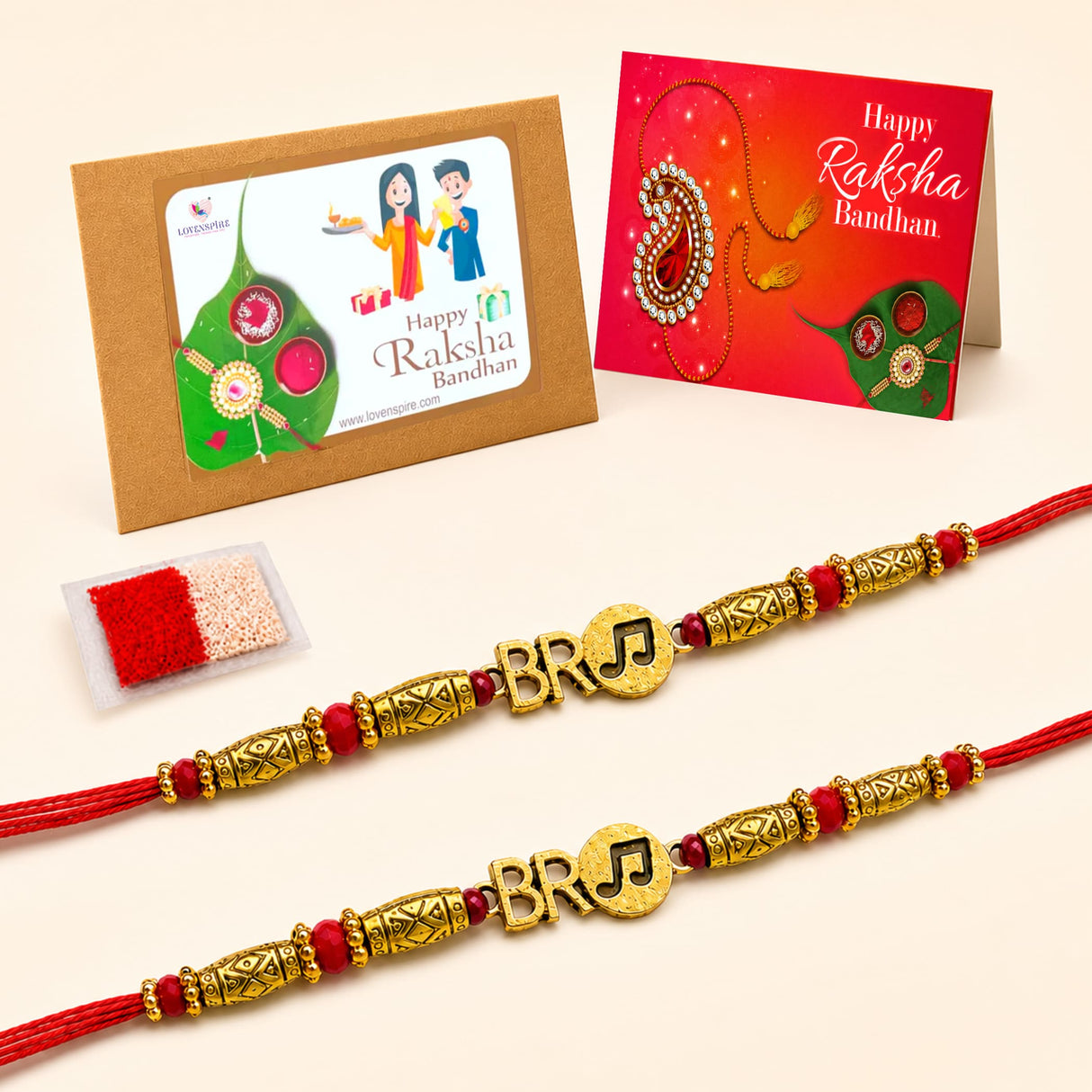 Gold-colored designer rakhi with red thread and decorative beads in a 2pc traditional raksha bandhan bracelet gift set