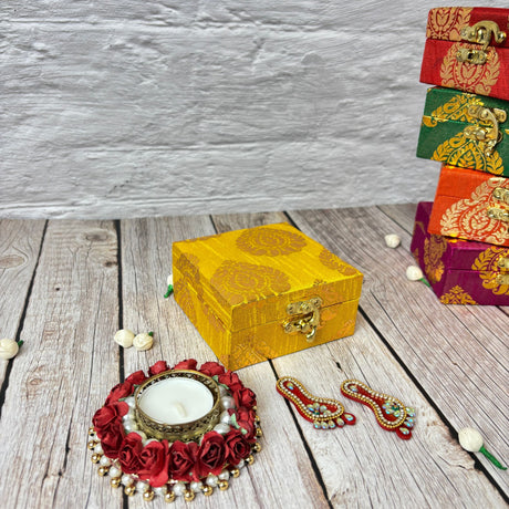 Yellow fabric-covered wooden box with brass clasp for Diwali festival gift hamper