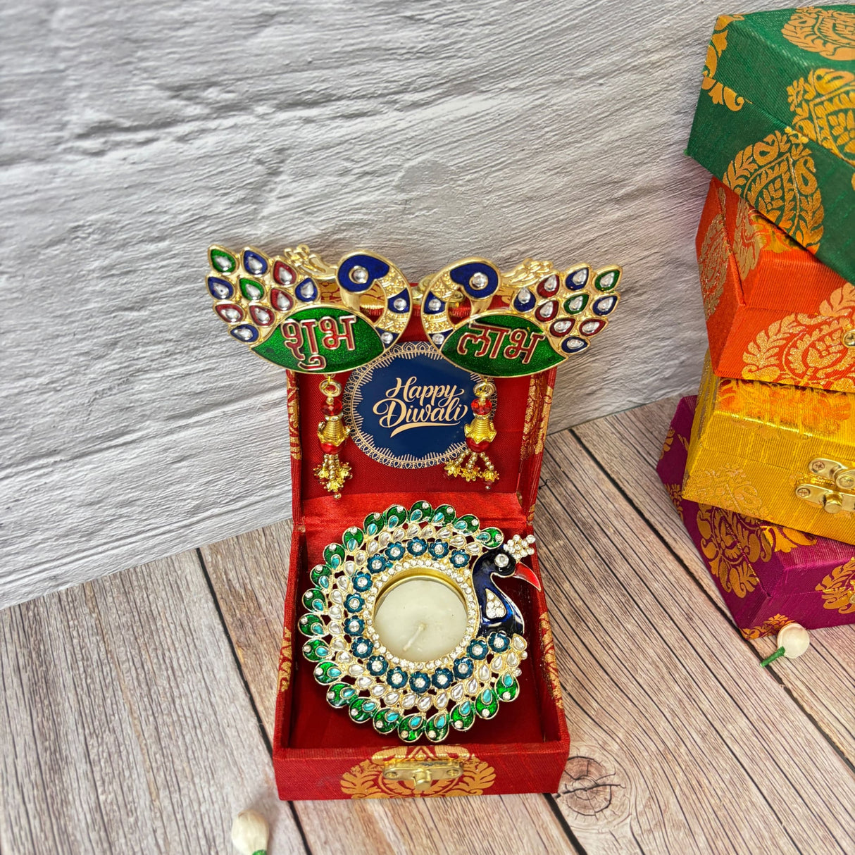Decorative peacock-themed Diwali gift set with diya holder for Indian festival celebrations