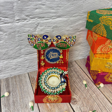 Decorative peacock-themed diya holder and gift box set for Diwali and festival gifting