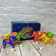 Colorful elephant-shaped tea light holders in decorative gift box for Diwali celebration