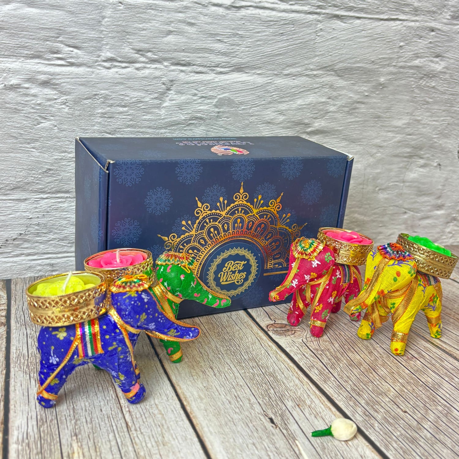 Colorful elephant-shaped candle holders with lit candles for Diwali celebration