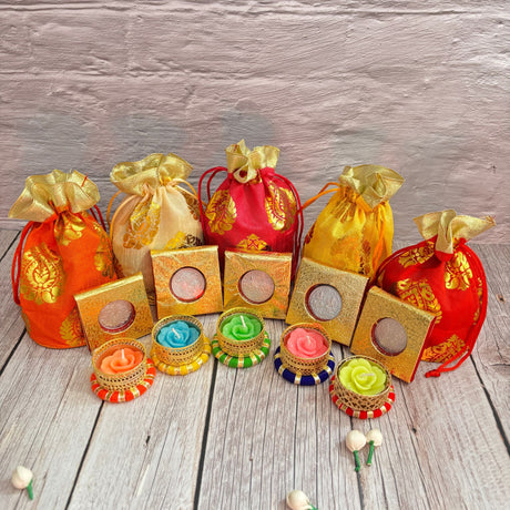 Colorful drawstring pouches with decorative candles for Diwali festival gifting