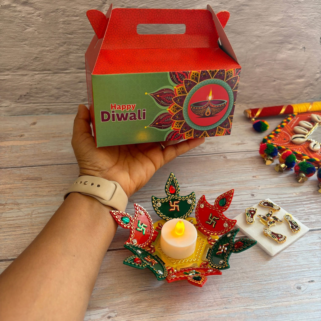 Diwali gift box with Indian festival decorations and acrylic Rangoli set