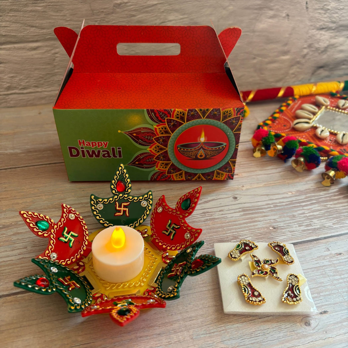 Diwali gift set with Indian festival hamper, acrylic Rangoli, and Lakshmi feet decor