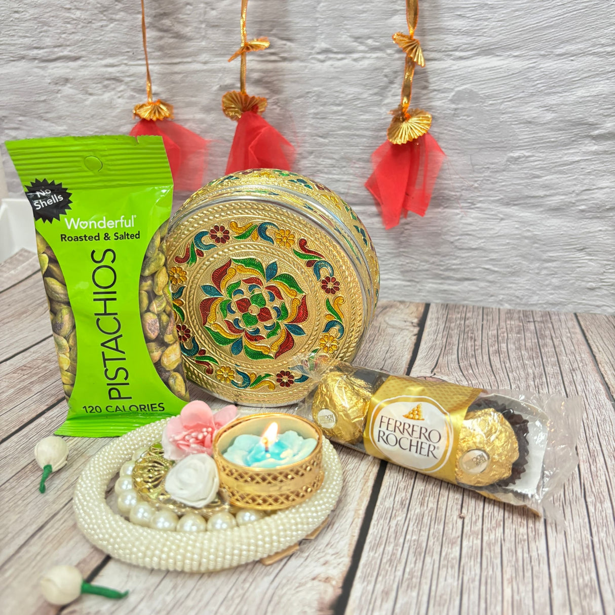 Festive Diwali gift hamper with pistachios chocolates decorative box and candle