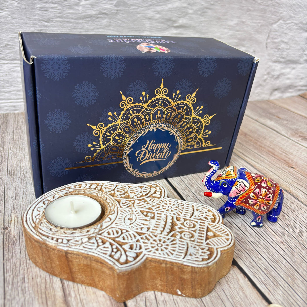 Navy blue Diwali gift box with gold mandala design and Happy Diwali text